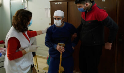 An MSF’s mobile medical team members providing vaccinations to elderly people in nursing homes, Lebanon.